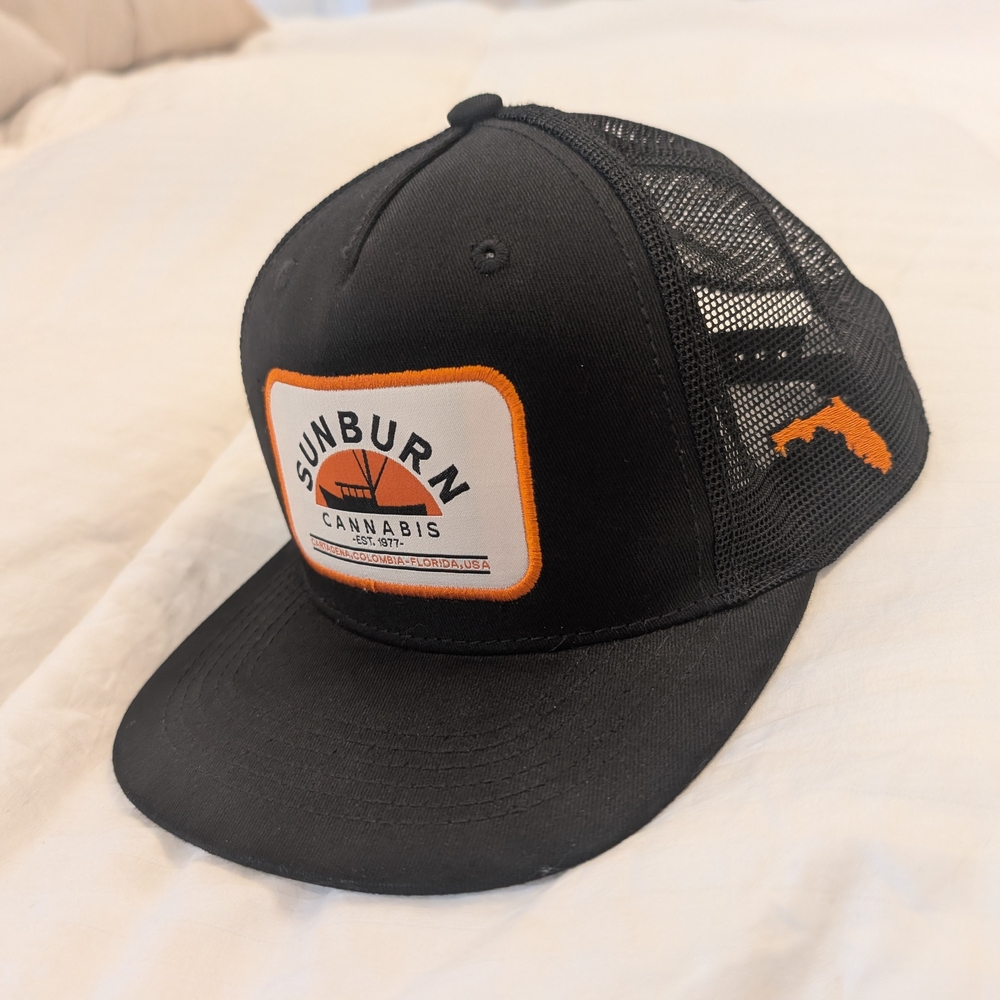 Sunburn Cannabis Black and Orange Trucker Hat